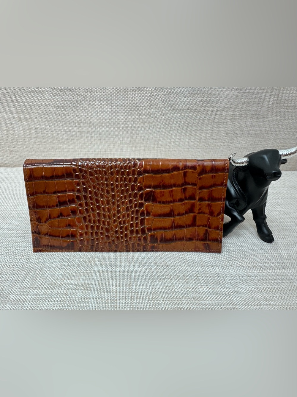 crocodile or alligator-embossed leather checkbook cover